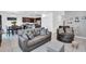 Spacious living room features an open-concept layout, seamlessly connecting to the kitchen and dining area at 136 Columbia Dr, Kissimmee, FL 34759