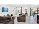 Comfortable living room with tile flooring, a cozy couch and well lit with natural light at 136 Columbia Dr, Kissimmee, FL 34759
