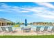 Resort-style pool with lounge chairs, tables, and a splash pad for all-day fun in the sun at 136 Columbia Dr, Kissimmee, FL 34759