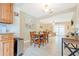 Spacious dining room next to living room, with laminated floors at 1420 N Grandview Ave, Daytona Beach, FL 32118