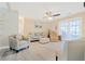Comfortable living room with laminated floors and a ceiling fan at 1420 N Grandview Ave, Daytona Beach, FL 32118