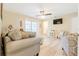 The living room is bright and spacious with laminated floors and a ceiling fan at 1420 N Grandview Ave, Daytona Beach, FL 32118
