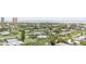 Picturesque neighborhood showcasing well-maintained homes surrounded by verdant greenery and palm trees near the ocean at 1420 N Grandview Ave, Daytona Beach, FL 32118