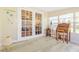 Enclosed sunroom featuring laminated floors and natural light at 1420 N Grandview Ave, Daytona Beach, FL 32118