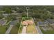 Aerial view showcasing a property's boundaries among mature trees, well-kept lawns, and a neighborhood setting at 1431 1St Ave, Deland, FL 32724