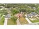 An elevated view of homes and tree canopies in a neighborhood. The homes have well-kept lawns and driveways at 1431 1St Ave, Deland, FL 32724