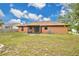 Spacious backyard showcasing the screened-in lanai, providing an ideal setting for outdoor living and relaxation at 1431 1St Ave, Deland, FL 32724