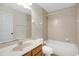 Clean bathroom with a shower and bathtub, single sink vanity with neutral countertop and tiled floors at 1431 1St Ave, Deland, FL 32724