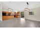 Well-equipped kitchen with a breakfast bar, tile floors, modern lighting, and sliding glass doors at 1431 1St Ave, Deland, FL 32724