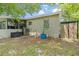 Backyard featuring an air conditioner, a shed, and a screened porch at 1455 Whitewood Dr, Deltona, FL 32725