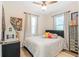 Cozy bedroom featuring bright natural light and comfortable furnishings at 1455 Whitewood Dr, Deltona, FL 32725
