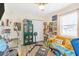 Creative living room with comfortable yellow couch, wood floors, and bright accents at 1455 Whitewood Dr, Deltona, FL 32725