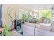 Relaxing screened patio with comfortable seating, stylish decor, and a mini beverage cooler at 1455 Whitewood Dr, Deltona, FL 32725