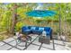 Outdoor patio with a comfortable blue seating area, perfect for relaxation and gatherings at 1455 Whitewood Dr, Deltona, FL 32725