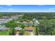 Aerial view of houses nestled among lush greenery near roadways, some featuring swimming pools at 1612 W Grant St, Orlando, FL 32805