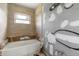 Bathroom under renovation featuring a new tub and window, ready to be customized at 1612 W Grant St, Orlando, FL 32805