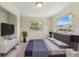 This bedroom boasts natural light, neutral walls and modern decor at 1612 W Grant St, Orlando, FL 32805