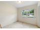 Bedroom with neutral walls and new windows allowing natural light at 1612 W Grant St, Orlando, FL 32805