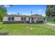 Charming single-story home featuring a classic facade and well-maintained front yard at 1612 W Grant St, Orlando, FL 32805