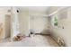 An unfinished kitchen shows potential with its window and open layout at 1612 W Grant St, Orlando, FL 32805