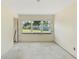 Bright living room has large windows overlooking the yard, a great space for personalization at 1612 W Grant St, Orlando, FL 32805