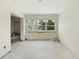 Bright living room features large window overlooking the yard, ready for customization at 1612 W Grant St, Orlando, FL 32805