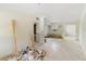 Spacious living room awaiting renovation with lots of natural light; a blank canvas for your vision at 1612 W Grant St, Orlando, FL 32805