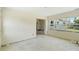 Open living room with large windows offering natural light, an inviting space to customize at 1612 W Grant St, Orlando, FL 32805