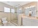 Modern bathroom with glass enclosed shower, granite counters and brushed metal fixtures at 1660 E Apache Cir, Deltona, FL 32725