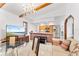 Charming living area featuring open concept layout, brick accents, and integrated kitchen at 1660 E Apache Cir, Deltona, FL 32725
