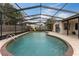 Large pool with a screened enclosure and a spacious patio area, perfect for enjoying the outdoors at 1660 E Apache Cir, Deltona, FL 32725