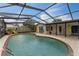 Large pool area with a screened enclosure and extended covered patio for lounging and entertaining at 1660 E Apache Cir, Deltona, FL 32725