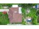 Aerial view of the home showing the roof, backyard and landscaping at 1702 Palmetto Ave, Deland, FL 32724
