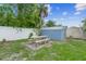 Backyard features a picnic table and a metal storage shed, great for outdoor activities at 1702 Palmetto Ave, Deland, FL 32724