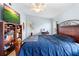 Comfortable bedroom featuring tile floors, closet space, and natural light from the windows at 1702 Palmetto Ave, Deland, FL 32724