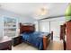 Comfortable bedroom featuring tile floors, a ceiling fan, and closet space at 1702 Palmetto Ave, Deland, FL 32724