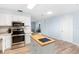 Bright kitchen featuring a butcher block island and stainless steel appliances with an open view to the living area at 1702 Palmetto Ave, Deland, FL 32724