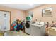 Laundry room with washer, dryer, utility sink and exterior door at 1702 Palmetto Ave, Deland, FL 32724