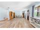 Spacious living room boasts beautiful flooring and ample natural light with an open concept layout at 1702 Palmetto Ave, Deland, FL 32724