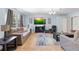 Spacious living room featuring tile floors and an abundance of seating at 1702 Palmetto Ave, Deland, FL 32724