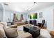 Bright living room featuring tile floors with an abundance of seating options at 1702 Palmetto Ave, Deland, FL 32724