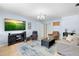Cozy living room featuring tile floors and a comfortable seating arrangement perfect for relaxing at 1702 Palmetto Ave, Deland, FL 32724