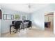 Well-lit home office featuring a ceiling fan, tile floors, and built-in desk for optimal work-from-home setup at 1702 Palmetto Ave, Deland, FL 32724