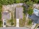 Birds eye aerial view of home, driveway, and fenced in back yard in a suburban neighborhood at 1846 N Acadian Dr, Deltona, FL 32725