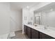 Spacious bathroom with dual sinks, dark cabinets, and a large mirror at 1846 N Acadian Dr, Deltona, FL 32725