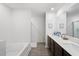 Bright bathroom with dual sinks, dark cabinets, and a separate bathtub at 1846 N Acadian Dr, Deltona, FL 32725