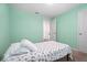 Bedroom with carpet and light green walls at 1846 N Acadian Dr, Deltona, FL 32725