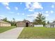 Beautiful single-story home with a two-car garage, spacious driveway, and a fully fenced yard at 1846 N Acadian Dr, Deltona, FL 32725