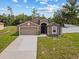 Well-kept single-story home with a two-car garage, lush lawn, and a charming front facade at 1846 N Acadian Dr, Deltona, FL 32725