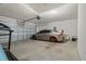 Spacious garage featuring a silver sports car with orange rims, a treadmill, and an automatic garage door opener at 1846 N Acadian Dr, Deltona, FL 32725
